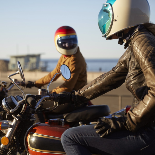 couple riding motorcycles